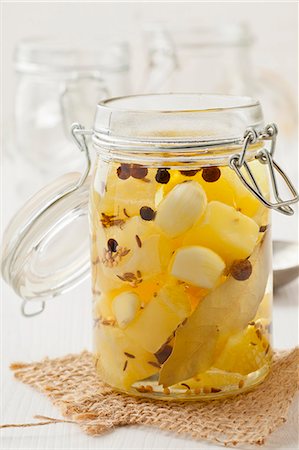 pickle - Handmade Harzer (sour milk cheese), preserved in oil with garlic, bay, pepper and allspice Stock Photo - Premium Royalty-Free, Code: 659-07599019
