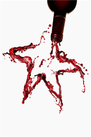 A star made from red wine, against a white background Stock Photo - Premium Royalty-Free, Code: 659-07599142
