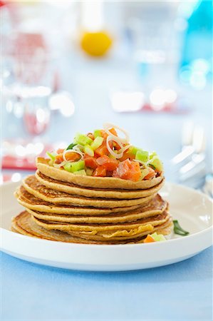 pile of dishes - Wholemeal pancakes with salmon and cucumber salad Stock Photo - Premium Royalty-Free, Code: 659-07599160