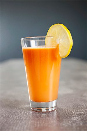 simsearch:659-06495307,k - a cocktail made out of fresh vegetable and fruit - juice / carrots, orange, beetroot, lemon Stock Photo - Premium Royalty-Free, Code: 659-07609931