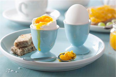 Soft-boiled eggs in egg cups Stock Photo - Premium Royalty-Free, Code: 659-07610019