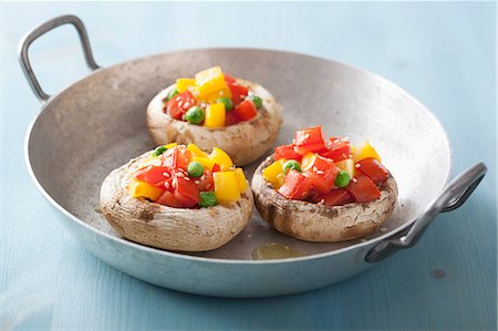 simsearch:659-06154334,k - Mushrooms stuffed with tomatoes, yellow peppers and peas Stock Photo - Premium Royalty-Free, Code: 659-07610022