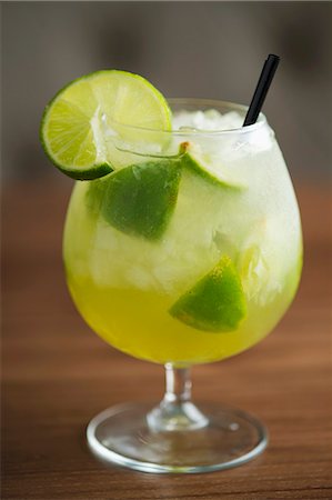 simsearch:659-01850296,k - A cocktail with limes and ice cubes Stock Photo - Premium Royalty-Free, Code: 659-07610275