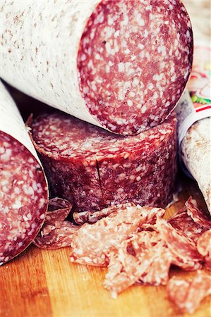 Whole salami and sliced salami Stock Photo - Premium Royalty-Free, Code: 659-07610317