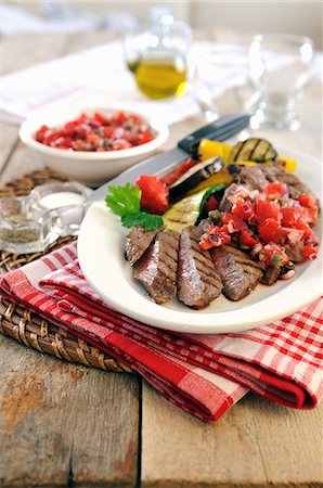 food meat nobody - Barbecued sirloin steak with grilled vegetables and tomato salsa Stock Photo - Premium Royalty-Free, Code: 659-07738895