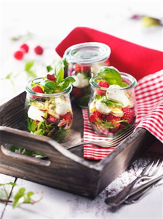 raspberry - Jars of raspberries with mozzarella and basil on a wooden tray Stock Photo - Premium Royalty-Free, Code: 659-07739088