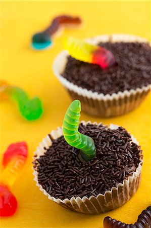 Two chocolate cupcakes decorated with jelly worms Stock Photo - Premium Royalty-Free, Code: 659-07739390