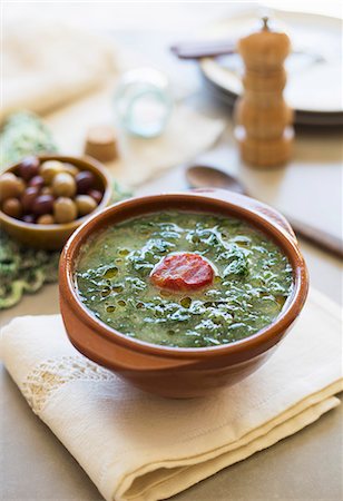first course - Caldo verde (potato and green kale soup, Portugal) with chorizo Stock Photo - Premium Royalty-Free, Code: 659-07958881