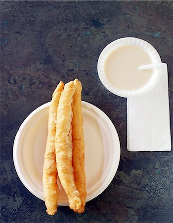 simsearch:659-06373117,k - Three Chinese doughnuts with sweet condensed milk Foto de stock - Sin royalties Premium, Código: 659-07959688