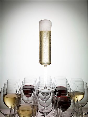 simsearch:659-06186663,k - A glass of champagne balanced on wine glasses Stock Photo - Premium Royalty-Free, Code: 659-07959708