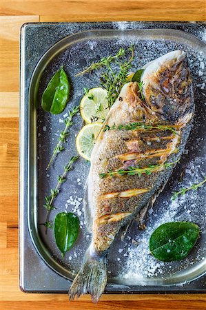 rectangled - Oven-baked seabream with herbs and lemon Stock Photo - Premium Royalty-Free, Code: 659-08147352