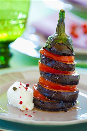 simsearch:659-08940768,k - An aubergine and tomato tower with goat's cream cheese Stock Photo - Premium Royalty-Free, Code: 659-08419123