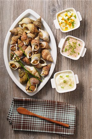 simsearch:400-07899875,k - Sea snails with three different sauces Stock Photo - Premium Royalty-Free, Code: 659-08419478