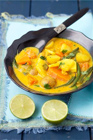 Indian vegetarian curry with pumpkin, pineapple, beans and potatoes Stock Photo - Premium Royalty-Free, Code: 659-08419588