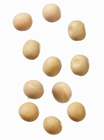 Soya beans on a white surface Stock Photo - Premium Royalty-Free, Code: 659-08419988