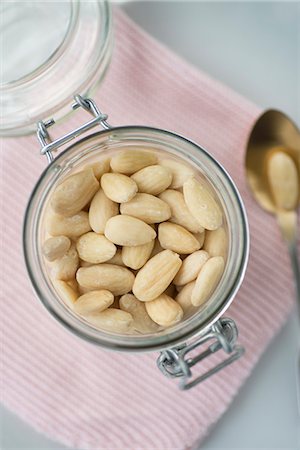 simsearch:659-07027183,k - A jar of shelled almonds (seen above) Stock Photo - Premium Royalty-Free, Code: 659-08420044