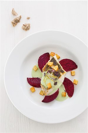 simsearch:659-06372915,k - Branzini on roasted beetroot with wasabi sauce and celery croutons Stock Photo - Premium Royalty-Free, Code: 659-08512774
