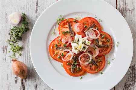 simsearch:659-06373046,k - Tomato salad with anchovies and feta cheese Stock Photo - Premium Royalty-Free, Code: 659-08513180