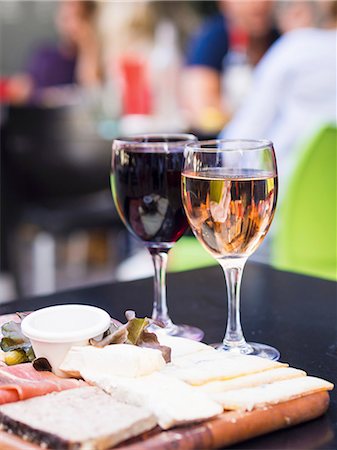 simsearch:659-06186663,k - Red and white Bordeaux wines served along with meat and cheese board in one of the restaurants in Bordeaux Stock Photo - Premium Royalty-Free, Code: 659-08895404