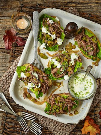 simsearch:659-07739811,k - Baked potato skins, filled with spicy minted lamb shoulder and lettuce Stock Photo - Premium Royalty-Free, Code: 659-08896018