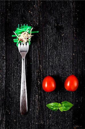 simsearch:659-08940768,k - Italian pasta with tomato and basil on fork On wooden board Stock Photo - Premium Royalty-Free, Code: 659-08896762