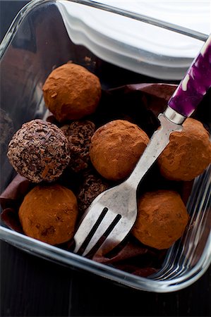 simsearch:841-06805239,k - Chocolate truffles in a glass bowl with a fork Stock Photo - Premium Royalty-Free, Code: 659-08897010