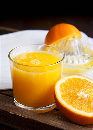 simsearch:659-06495307,k - A glass of freshly squeezed orange juice Stock Photo - Premium Royalty-Free, Code: 659-08897133