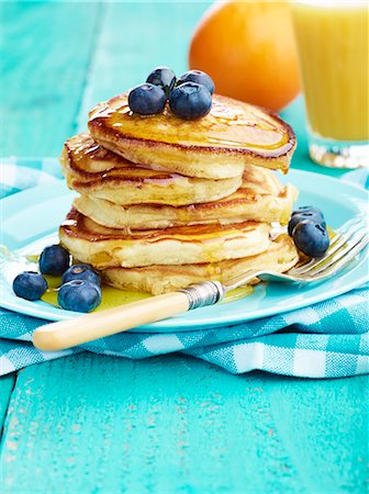 pancake - Pancake stack with maple syrup and blueberries and orange juice Stock Photo - Premium Royalty-Free, Code: 659-08897282