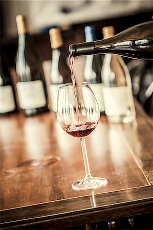 simsearch:659-06186663,k - Red wine being poured into a glass Stock Photo - Premium Royalty-Free, Code: 659-08897326