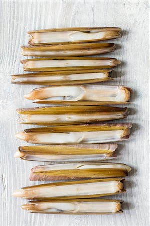 Razor clams on a white wooden table Stock Photo - Premium Royalty-Free, Code: 659-08904157