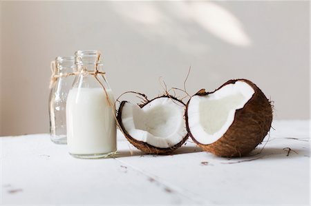 An open coconut and a bottle of coconut milk Stock Photo - Premium Royalty-Free, Code: 659-08904517