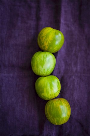 simsearch:659-08147216,k - Four green zebra tomatoes on a violet cloth Stock Photo - Premium Royalty-Free, Code: 659-08905320