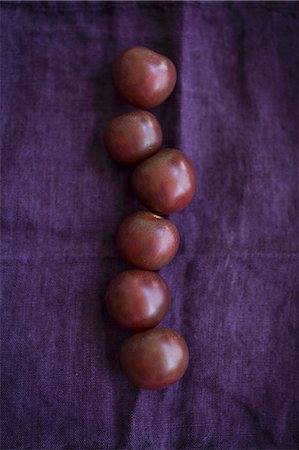 simsearch:659-08147216,k - Six black tomatoes on a violet cloth Stock Photo - Premium Royalty-Free, Code: 659-08905323