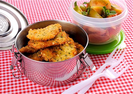 simsearch:659-08940768,k - Chicken esclaopes in breadcrumbs with tomato & peppermint salad Stock Photo - Premium Royalty-Free, Code: 659-08905649