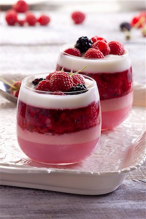 simsearch:659-07069181,k - A layered dessert with raspberry mousse, jelly, joghurt and fresh berries Stock Photo - Premium Royalty-Free, Code: 659-08905844