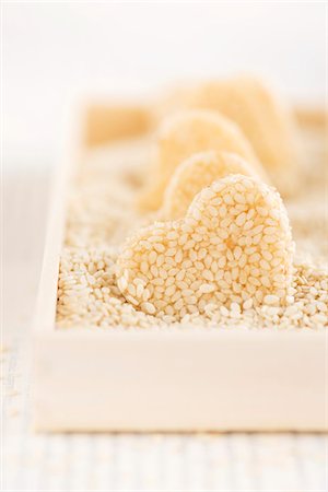 Homemade heart-shaped sesame seed sweets Stock Photo - Premium Royalty-Free, Code: 659-08906306