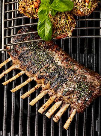 simsearch:659-08148038,k - A rack of lamb with herbs and stuffed tomatoes on a barbecue Stock Photo - Premium Royalty-Free, Code: 659-08906546