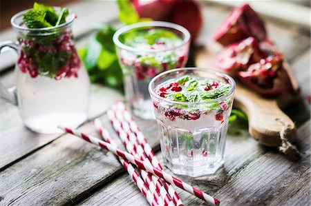 simsearch:659-06495307,k - Detox drink with lemon water, mint and pomegranate seeds Stock Photo - Premium Royalty-Free, Code: 659-08939966