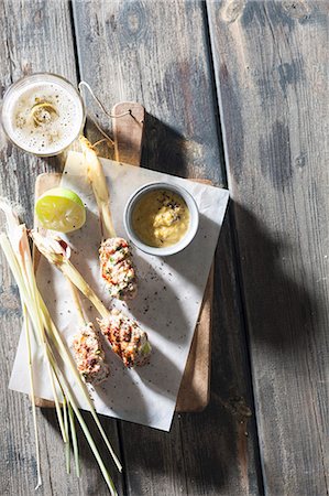 simsearch:659-08148038,k - Minced meat and lemongrass skewers with a yellow pepper dip (seen from above) Stock Photo - Premium Royalty-Free, Code: 659-08940297
