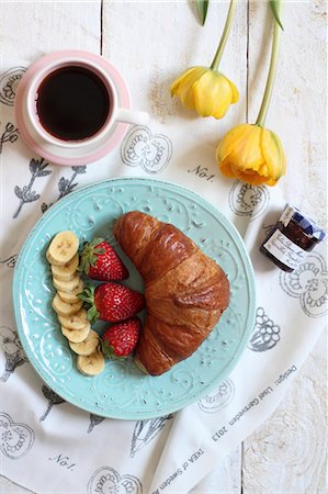 simsearch:659-06901837,k - A sweet breakfast with a croissant, fruit, jam and coffee Stock Photo - Premium Royalty-Free, Code: 659-08940340