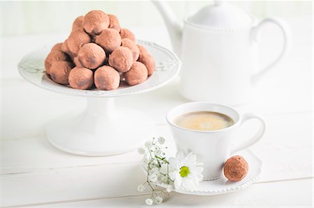 simsearch:841-06805239,k - Chocolate truffles on a white table with coffee Stock Photo - Premium Royalty-Free, Code: 659-08940481