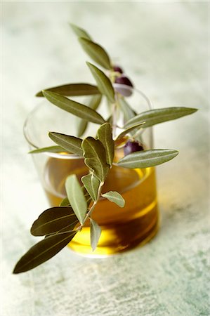 simsearch:659-07027144,k - A glass of olive oil with an olive sprig Stock Photo - Premium Royalty-Free, Code: 659-08940739