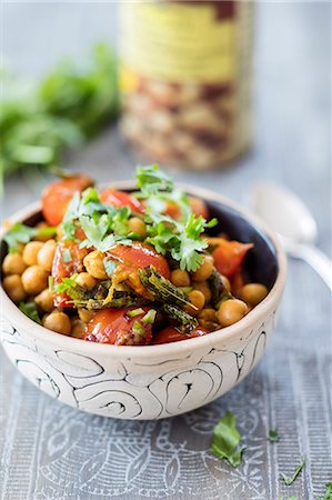 simsearch:659-06373046,k - A chickpea bowl with cherry tomatoes and curry leaves Stock Photo - Premium Royalty-Free, Code: 659-09124210