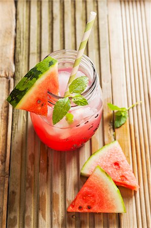 simsearch:659-06495307,k - Watermelon juice in a glass jar with ice cubes, mint and a slice of fresh watermelon Stock Photo - Premium Royalty-Free, Code: 659-09124917