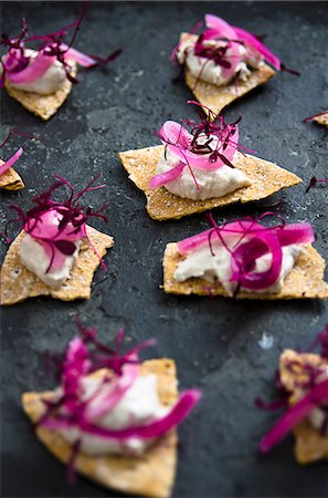 Tortilla chips with mackerel cream, red wine onions and red amaranth shoots Stock Photo - Premium Royalty-Free, Code: 659-09125732