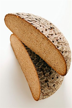 rye bread - A loaf of farmhouse bread, halved Stock Photo - Premium Royalty-Free, Code: 659-01844146