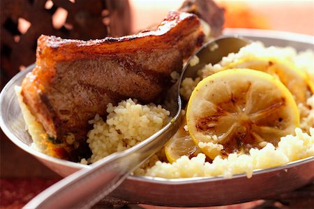 simsearch:659-06186142,k - Lamb cutlets with couscous and lemon Stock Photo - Premium Royalty-Free, Code: 659-01845406