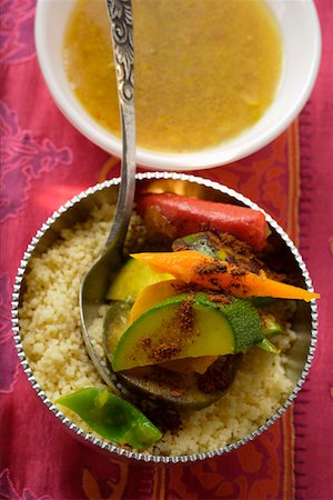 Couscous with vegetables and cinnamon in silver bowl Stock Photo - Premium Royalty-Free, Code: 659-01845416