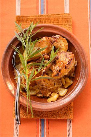 Braised chicken with onions and tarragon in tajine Stock Photo - Premium Royalty-Free, Code: 659-01845472