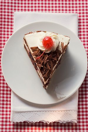 simsearch:659-01848790,k - Piece of Black Forest gateau with cherry Stock Photo - Premium Royalty-Free, Code: 659-01846289